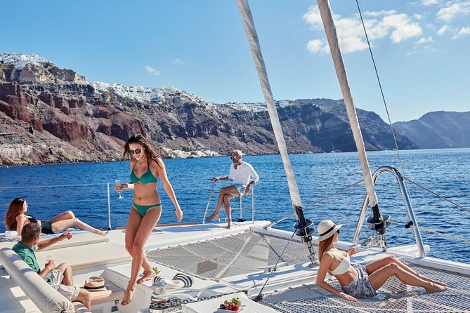Santorini Sunset Luxury Sailing Catamaran Cruise with BBQ, drinks, transfer - Pickup from your accommodation and arrival at the port