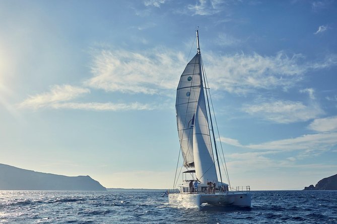 Santorini Sunset Luxury Sailing Catamaran Cruise with BBQ, drinks, transfer - White Beach: the longest stop and barbecue setting