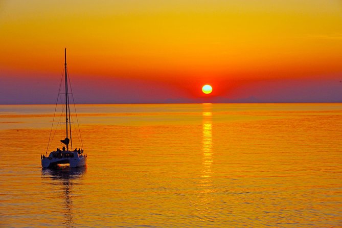 Santorini Sunset Luxury Sailing Catamaran Cruise with BBQ, drinks, transfer - Red Beach: a colorful first swim