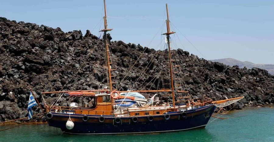 Santorini: Thirassia Islands and Volcano Guided Cruise - Walking Across the Black Rock of Nea Kameni