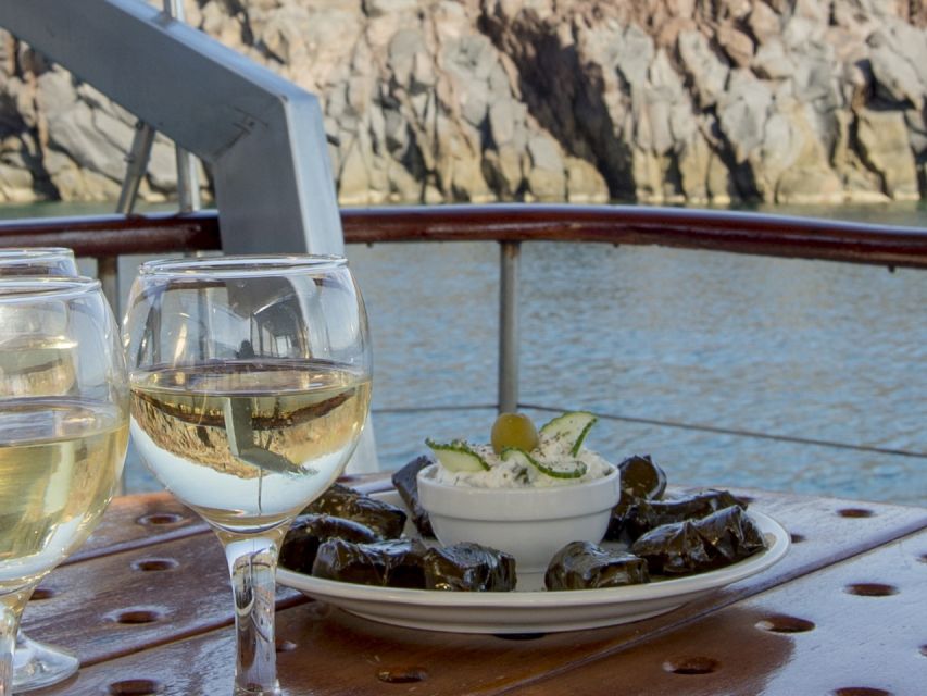 Santorini: Traditional Wooden Boat Tour with Meal and Wine - Black Mountain and the first swim
