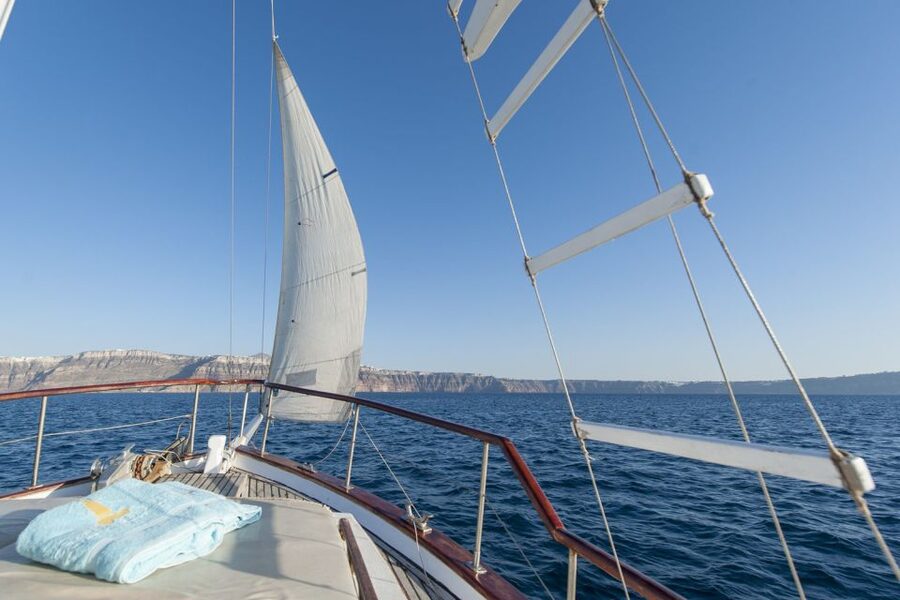 Santorini: Traditional Wooden Boat Tour with Meal and Wine - Swimming at the volcanic hot springs