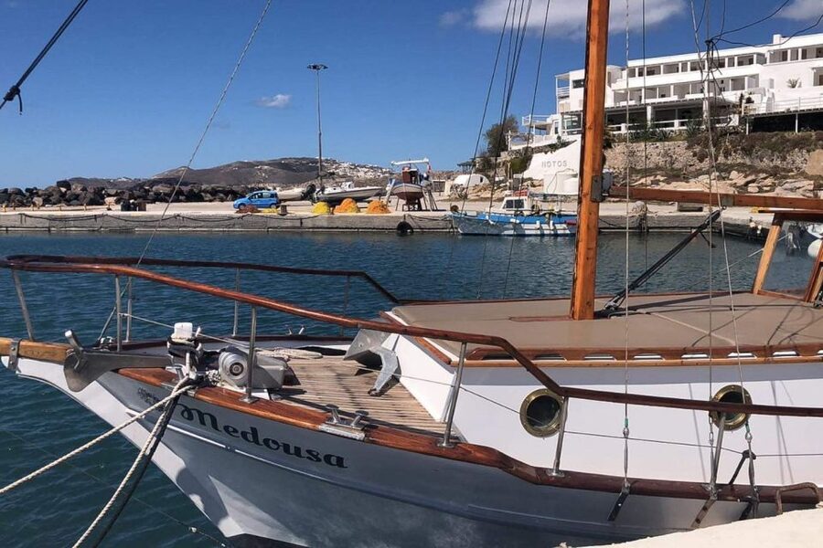 Santorini: Traditional Wooden Boat Tour with Meal and Wine - Greek food, local wine, and a proper pause