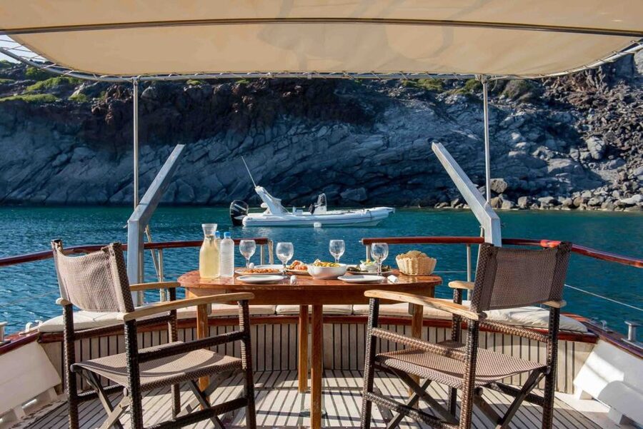 Santorini: Traditional Wooden Boat Tour with Meal and Wine - Choosing the sunset departure