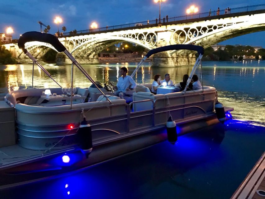 Seville: Exclusive River Boat Tour with Tapas - Passing beneath Triana Bridge