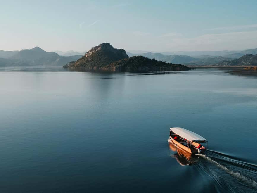 Skadar Lake National Park: Guided Boat Tour to Kom Monastery - Kamenik: wine, juice, and priganice on the water
