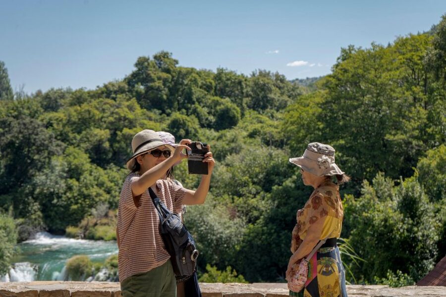 Split: Krka Waterfalls With Boat Cruise, Wine and Olive Oil - Arriving in Skradin by boat