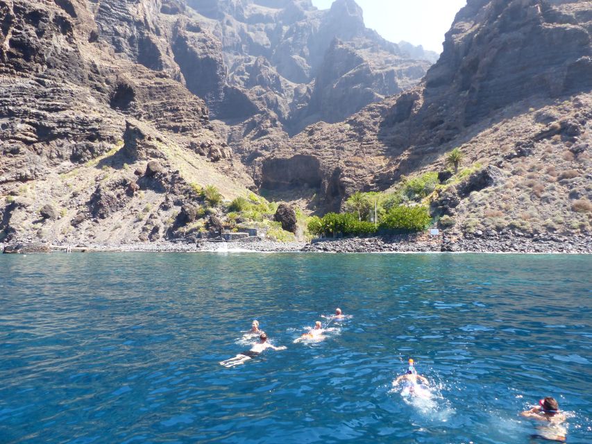 Tenerife: Los Gigantes Whale Watching Cruise by Sail Boat - Returning beneath the cliffs