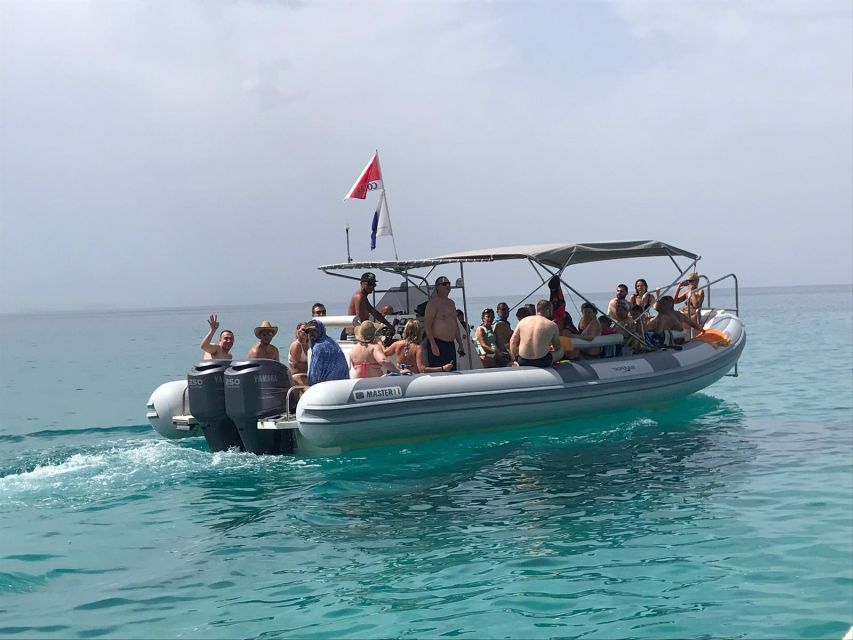 Tropea: Capo Vaticano Boat Trip with Snorkeling & Drink - The crew, music, and group atmosphere
